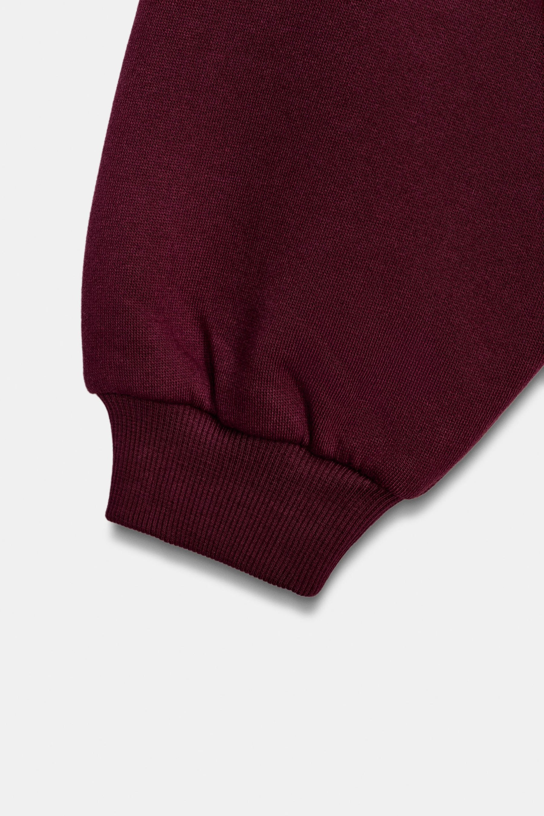 Ruffle-Trimmed Varsity Sweatshirt