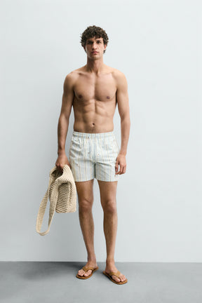 EMBROIDERED MID-LENGTH SWIMMING TRUNKS - Image 1