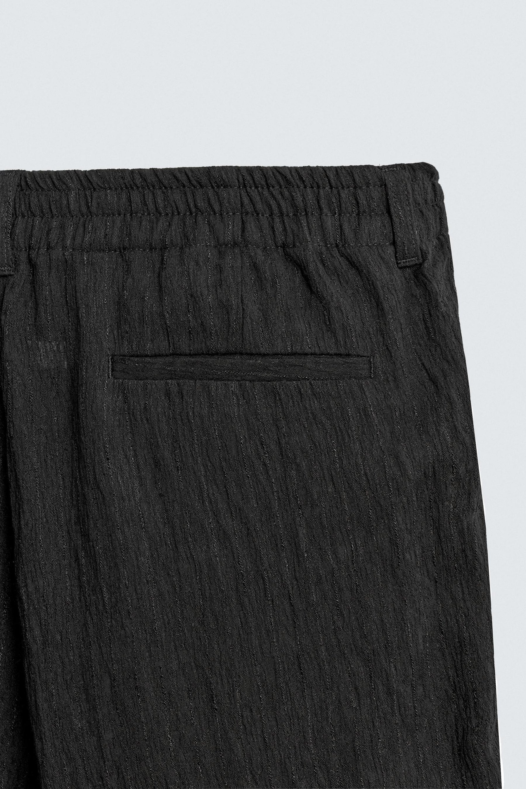 REGULAR FIT TROUSERS WITH IRREGULAR TEXTURE - Image 10