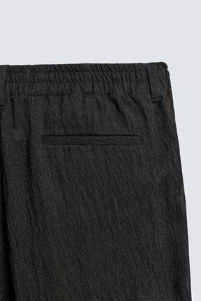 REGULAR FIT TROUSERS WITH IRREGULAR TEXTURE - Image 10