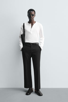 LOOSE-FITTING FLARED TROUSERS - Image 1