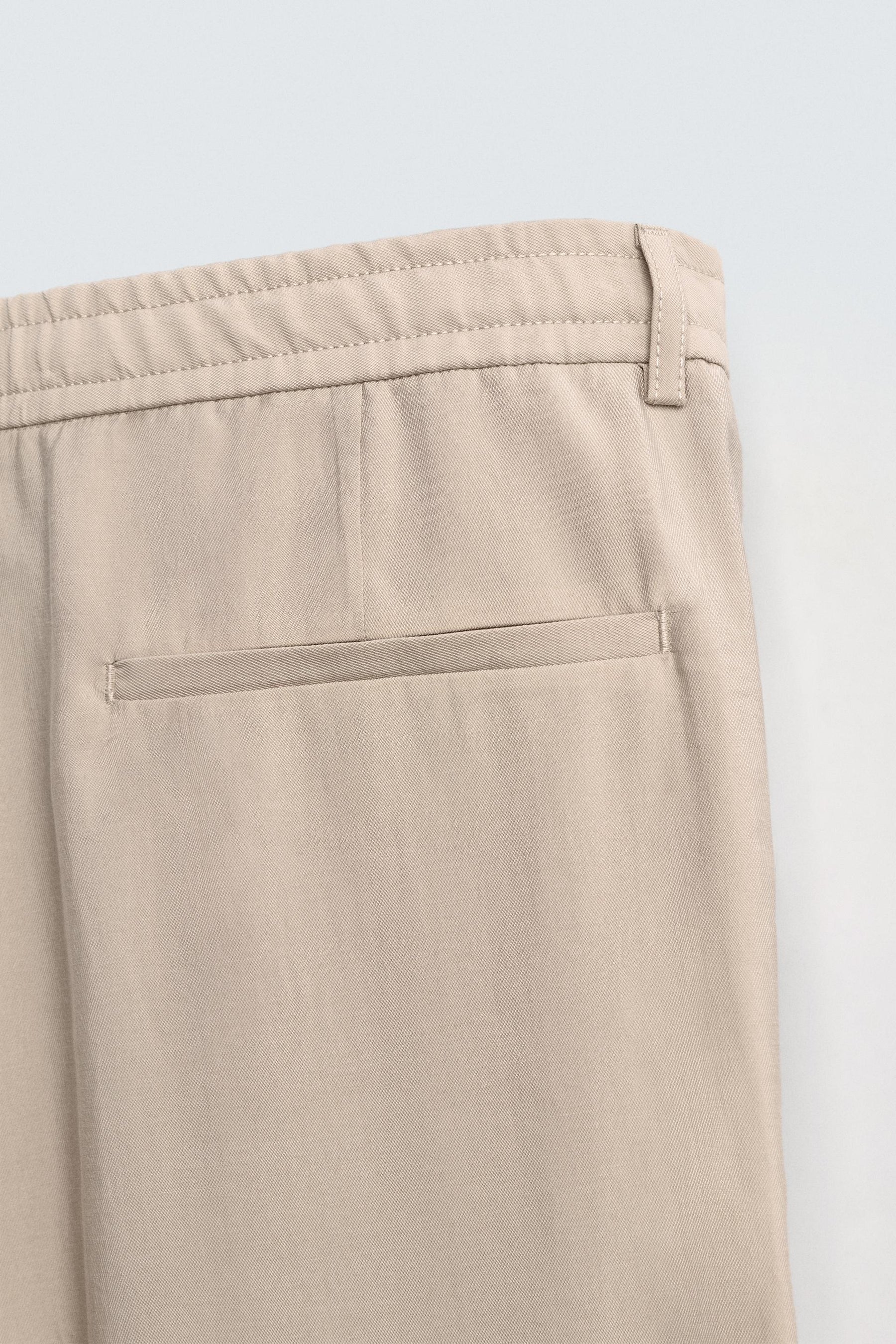 FLOWING PLEATED TROUSERS - Image 10