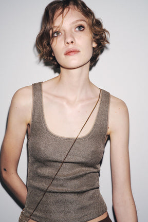 Textured metallic thread top