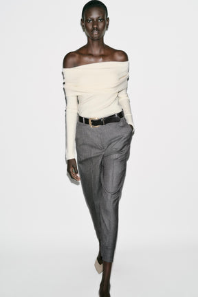 Trousers with turn-up hems.