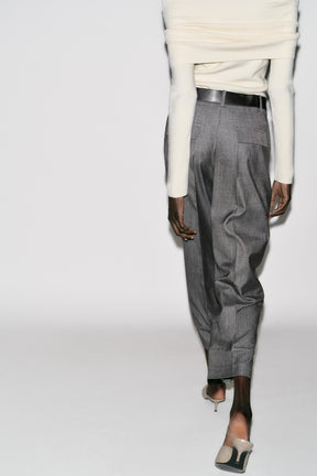 Trousers with turn-up hems.