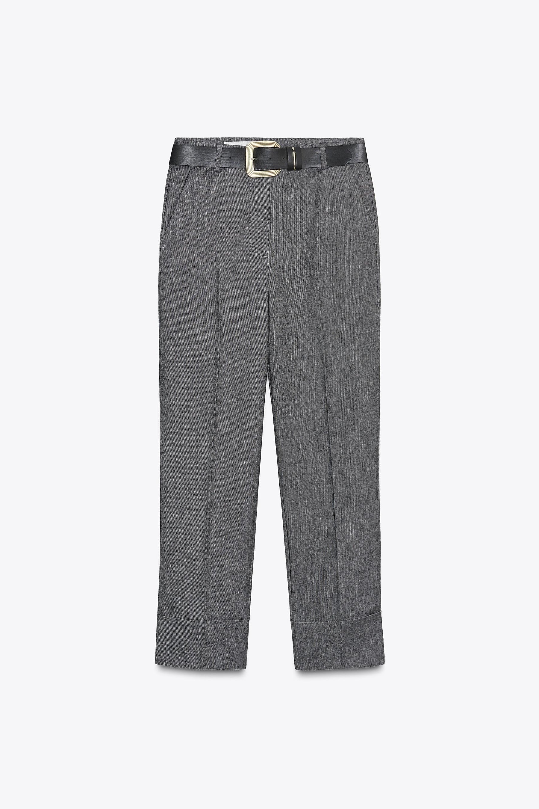 Trousers with turn-up hems.