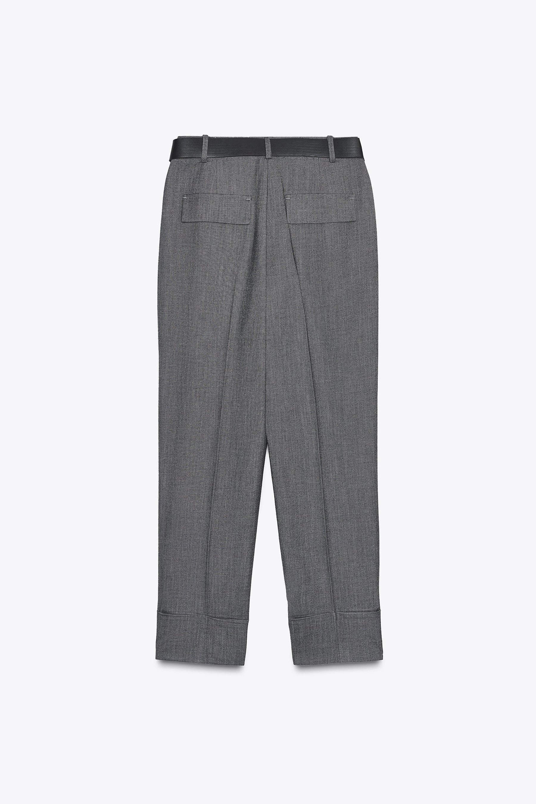 Trousers with turn-up hems.