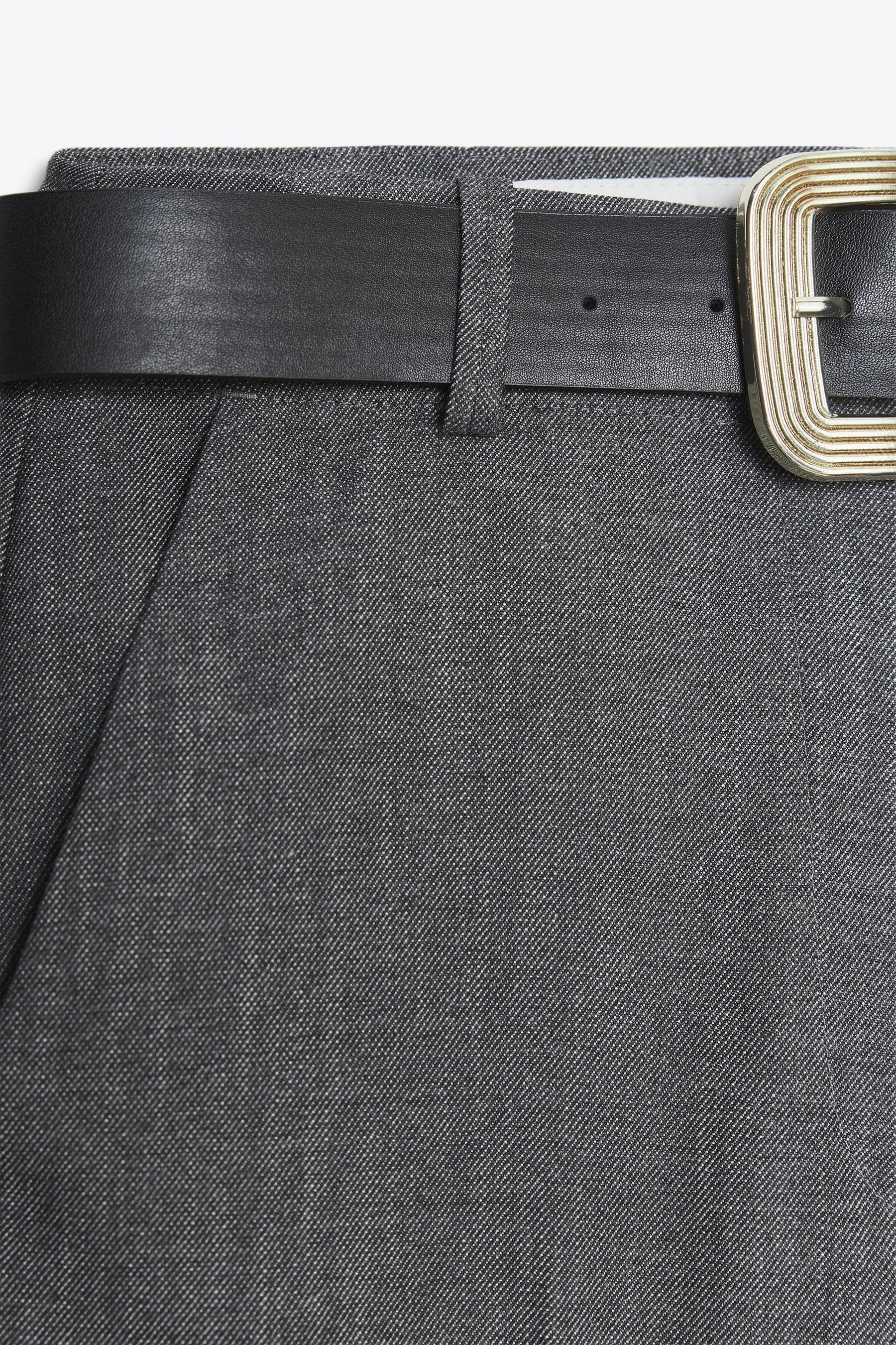 Trousers with turn-up hems.