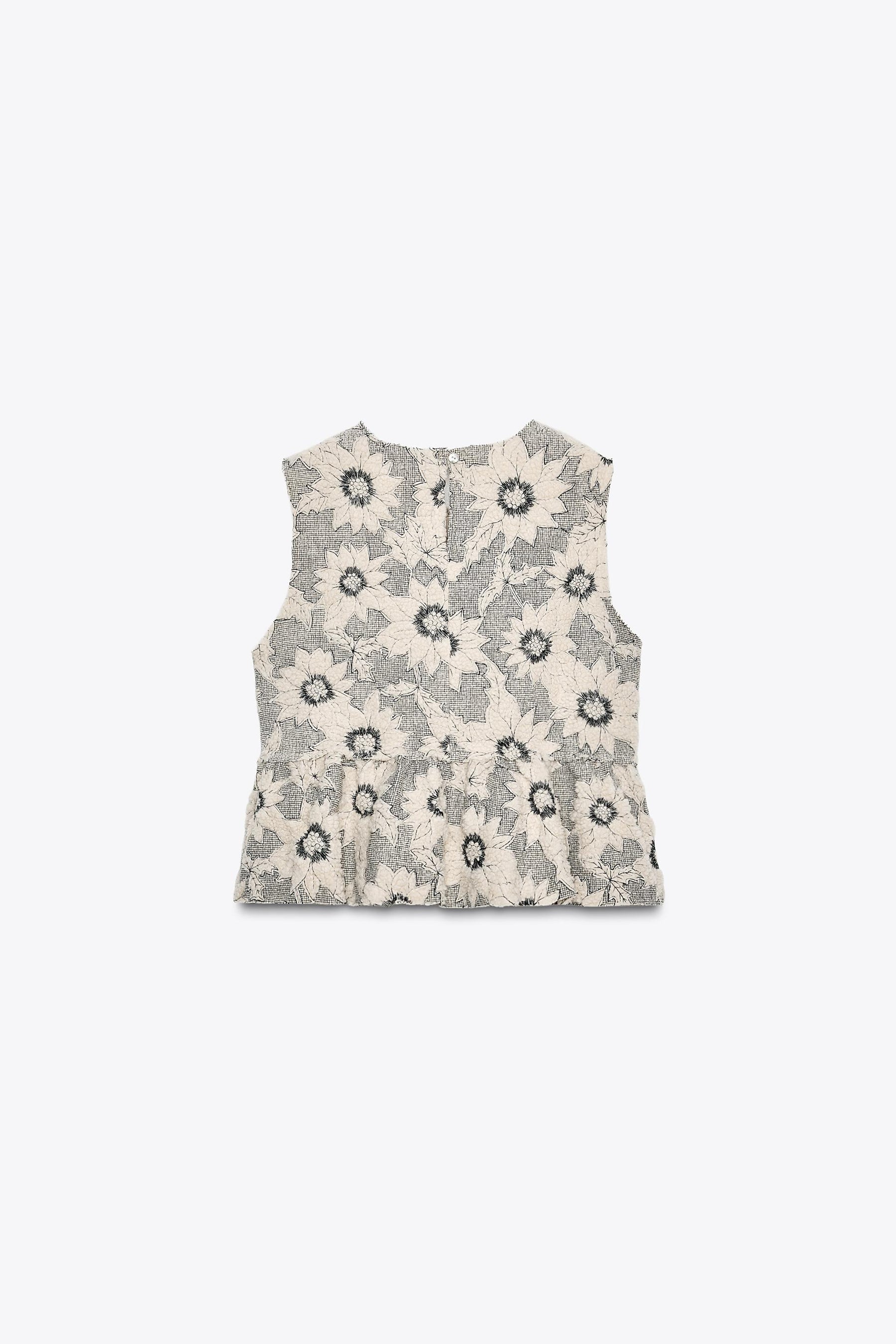 FLORAL TEXTURED PEPLUM TOP