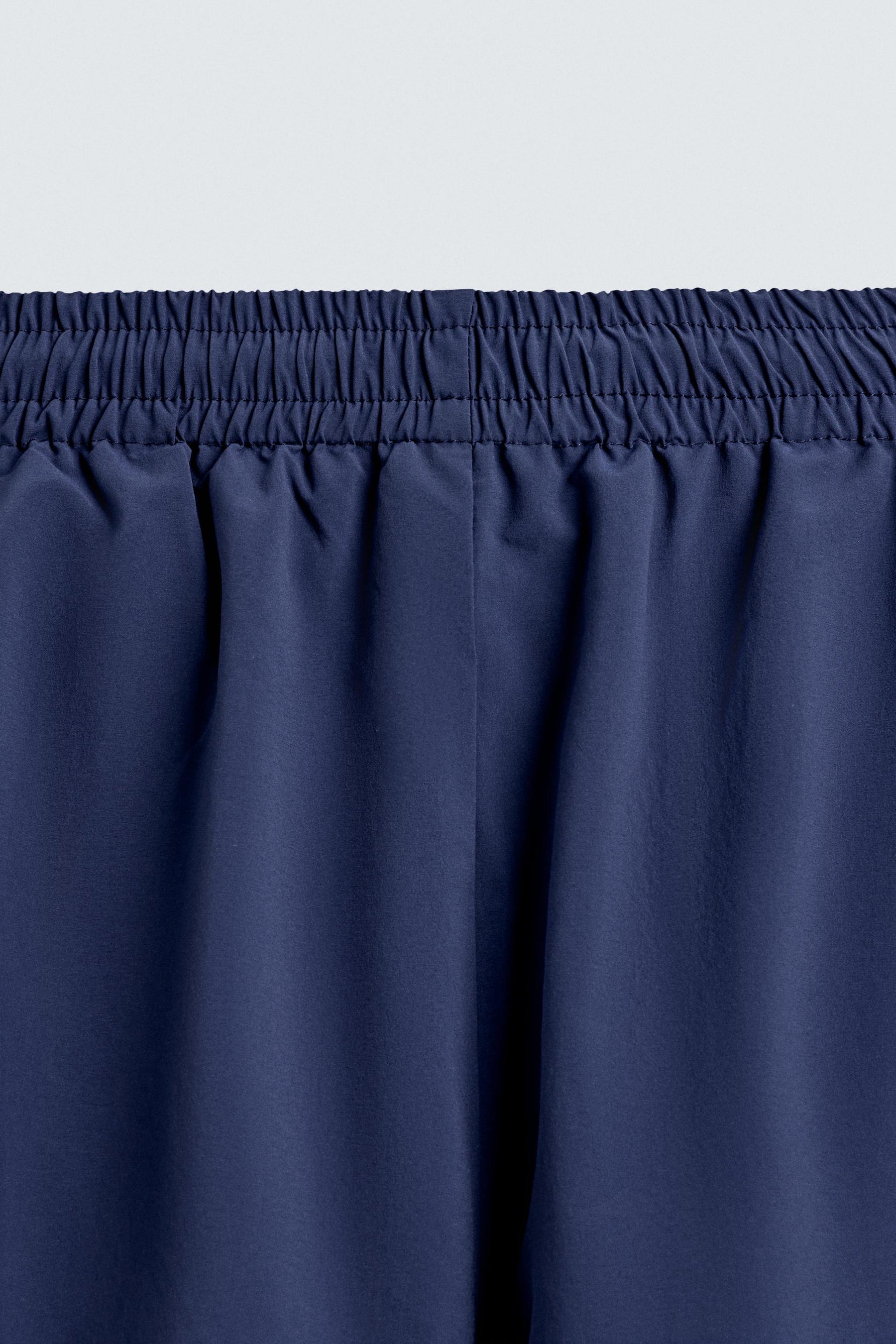 TECHNICAL TROUSERS WITH TAPING - Image 9