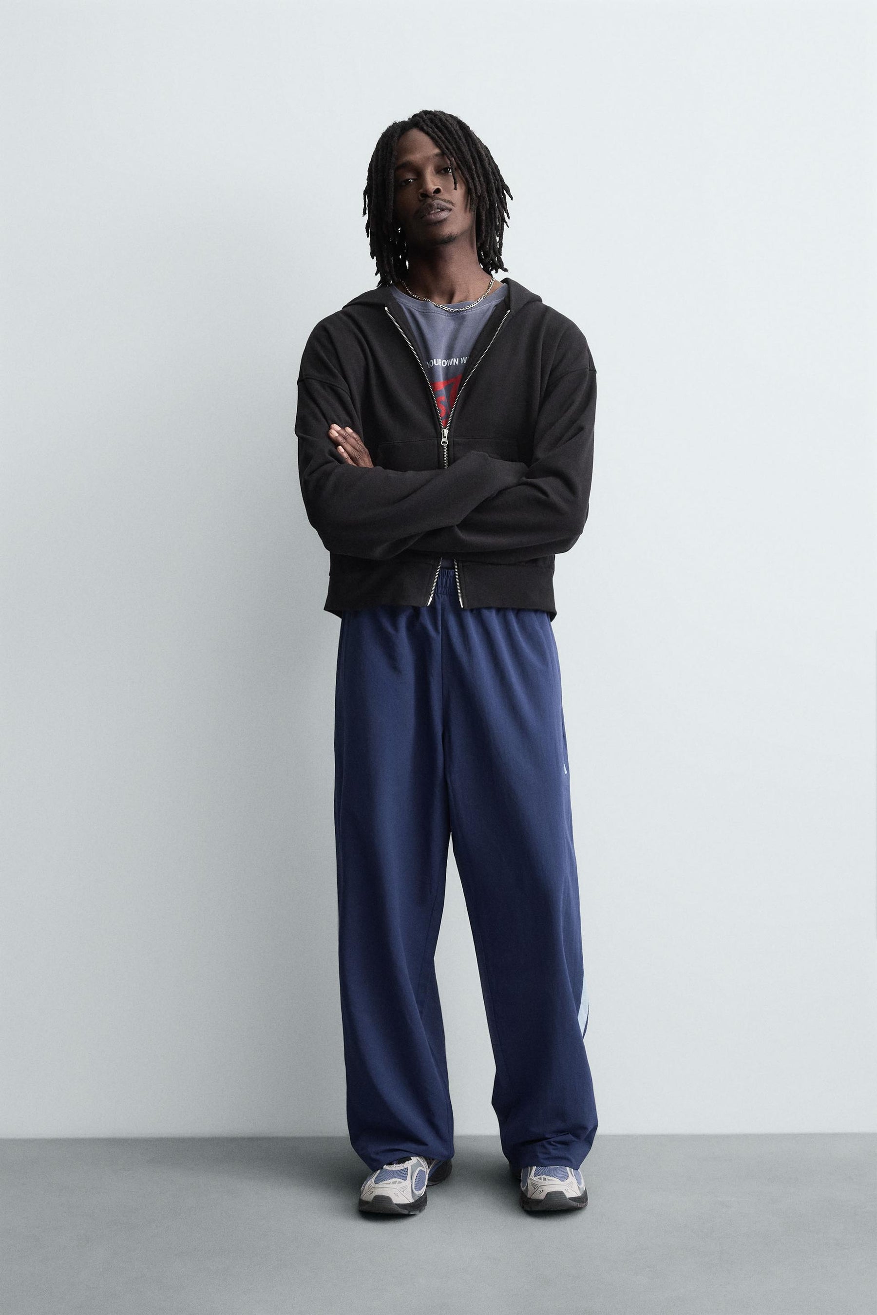 TECHNICAL TROUSERS WITH TAPING - Image 1