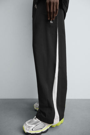 TECHNICAL TROUSERS WITH TAPING - Image 5