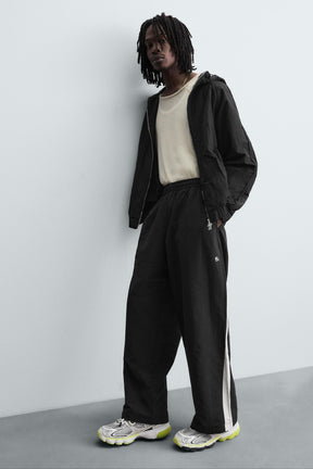 TECHNICAL TROUSERS WITH TAPING - Image 6