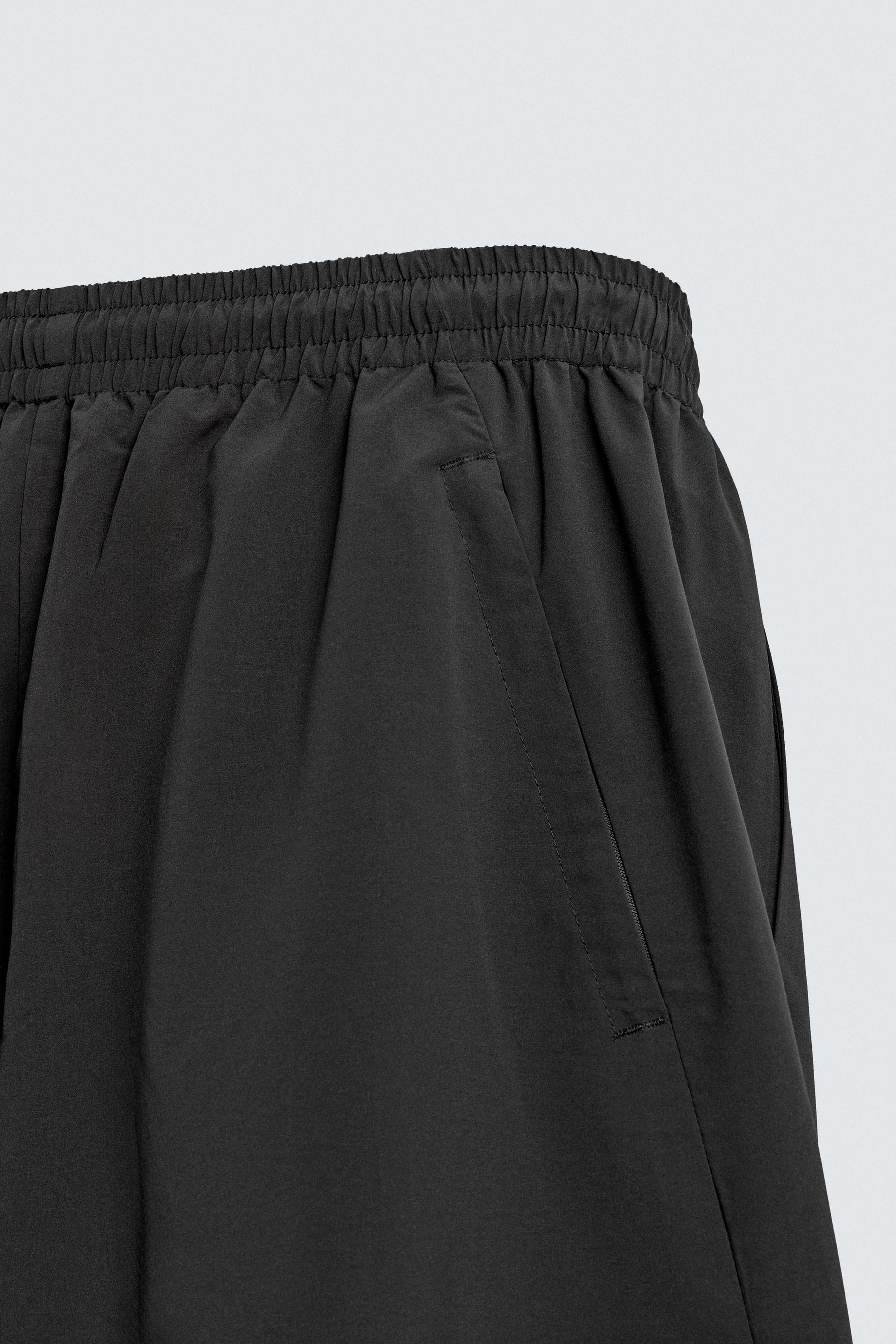 TECHNICAL TROUSERS WITH TAPING - Image 10