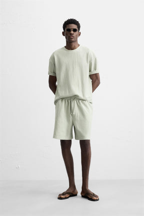 TEXTURED JOGGER BERMUDA SHORTS - Image 1