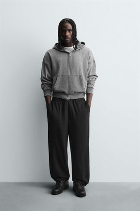 TEXTURED RELAXED FIT TROUSERS - Image 1