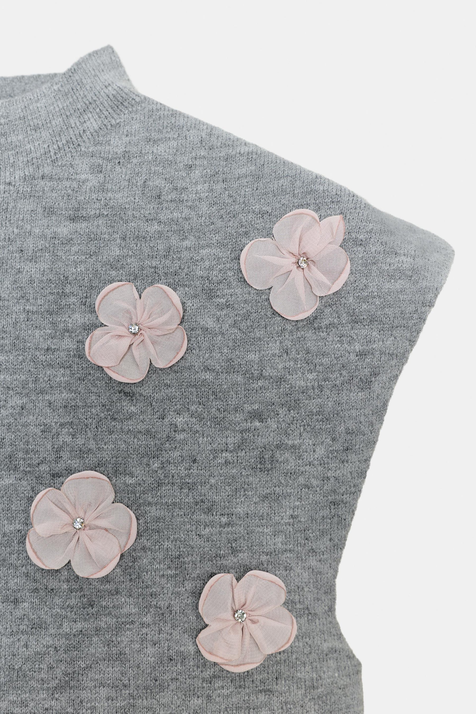 Floral embellished relief top