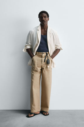 LIMITED EDITION PAINT SPLATTER TROUSERS - Image 1