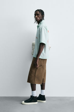 STRIPED SHIRT WITH CONTRAST SLOGAN - Image 4