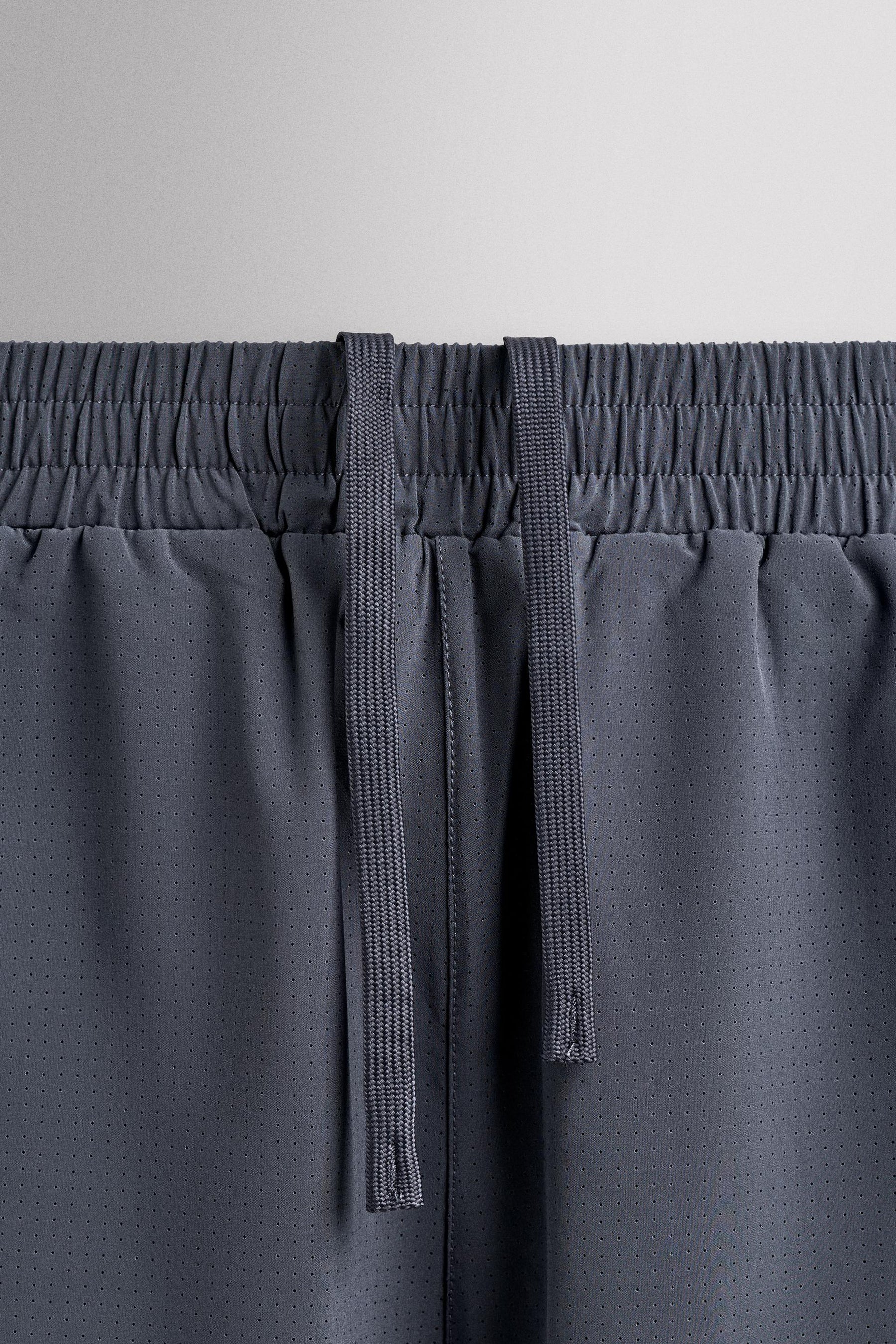 CONTRAST PERFORATED SHORTS - Image 10