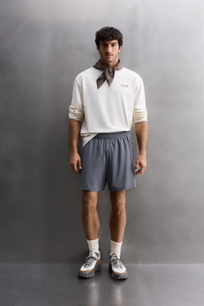 CONTRAST PERFORATED SHORTS - Image 1