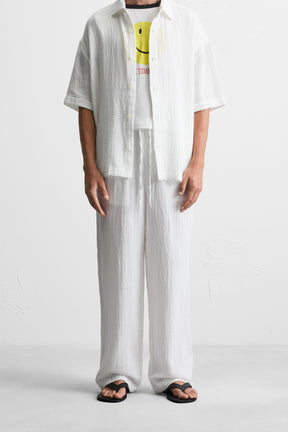 CRINKLED-EFFECT TROUSERS - Image 2