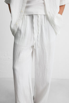 CRINKLED-EFFECT TROUSERS - Image 5