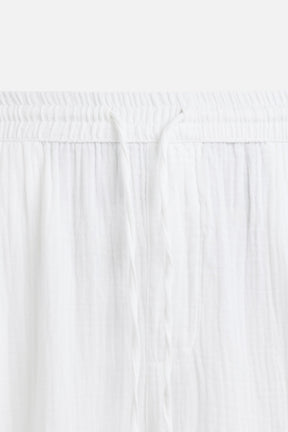 CRINKLED-EFFECT TROUSERS - Image 9