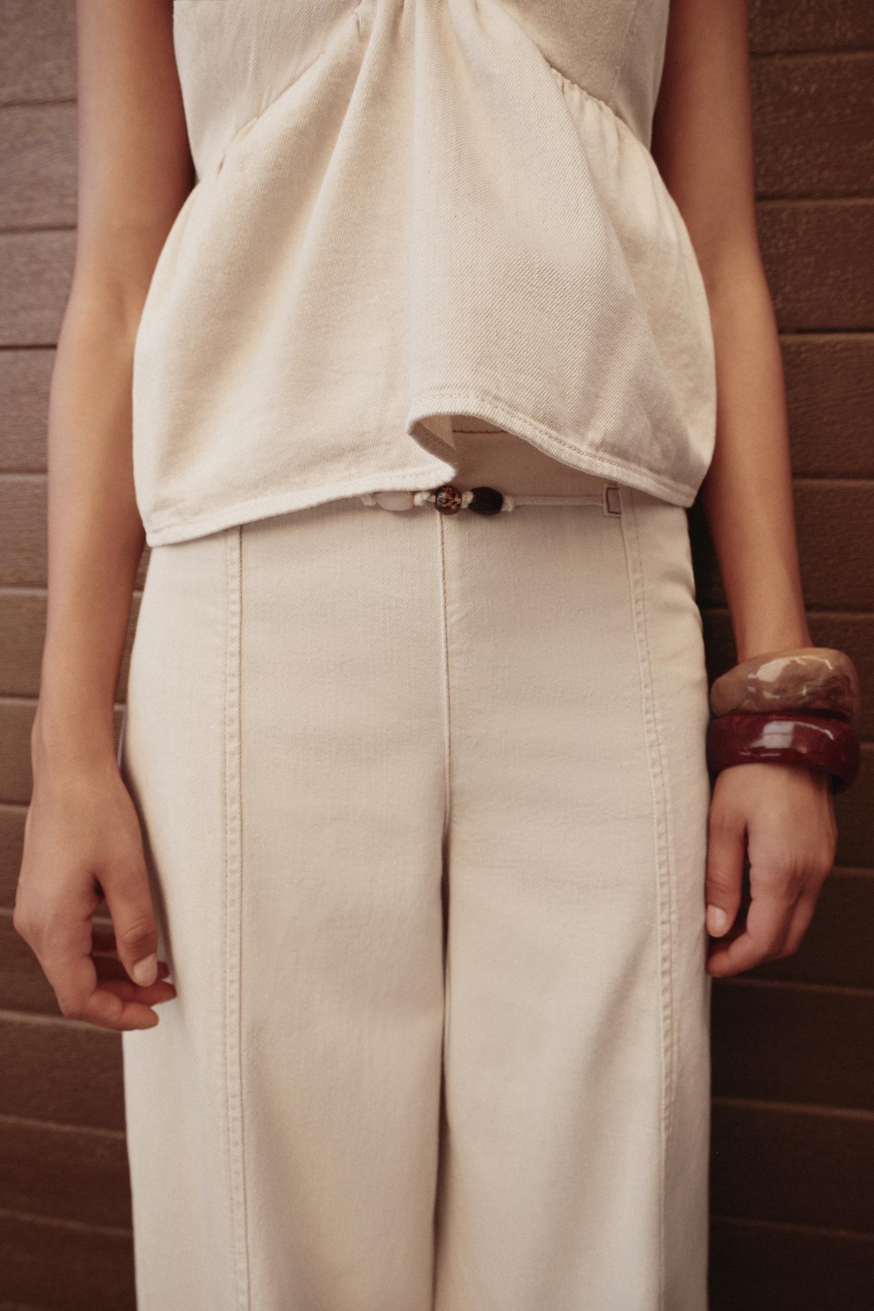 High-waist beaded jeans