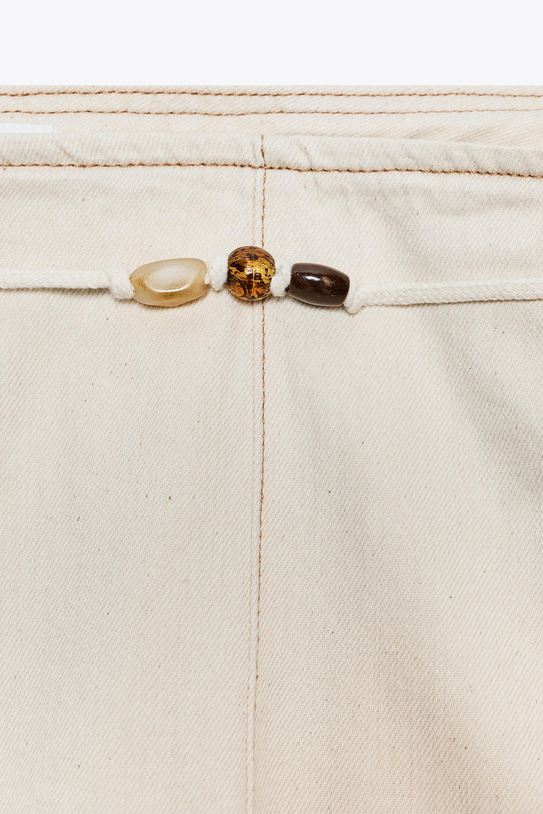 High-waist beaded jeans