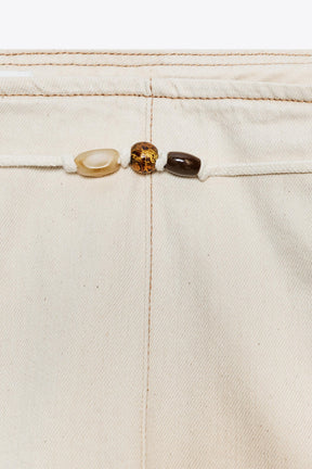 High-waist beaded jeans