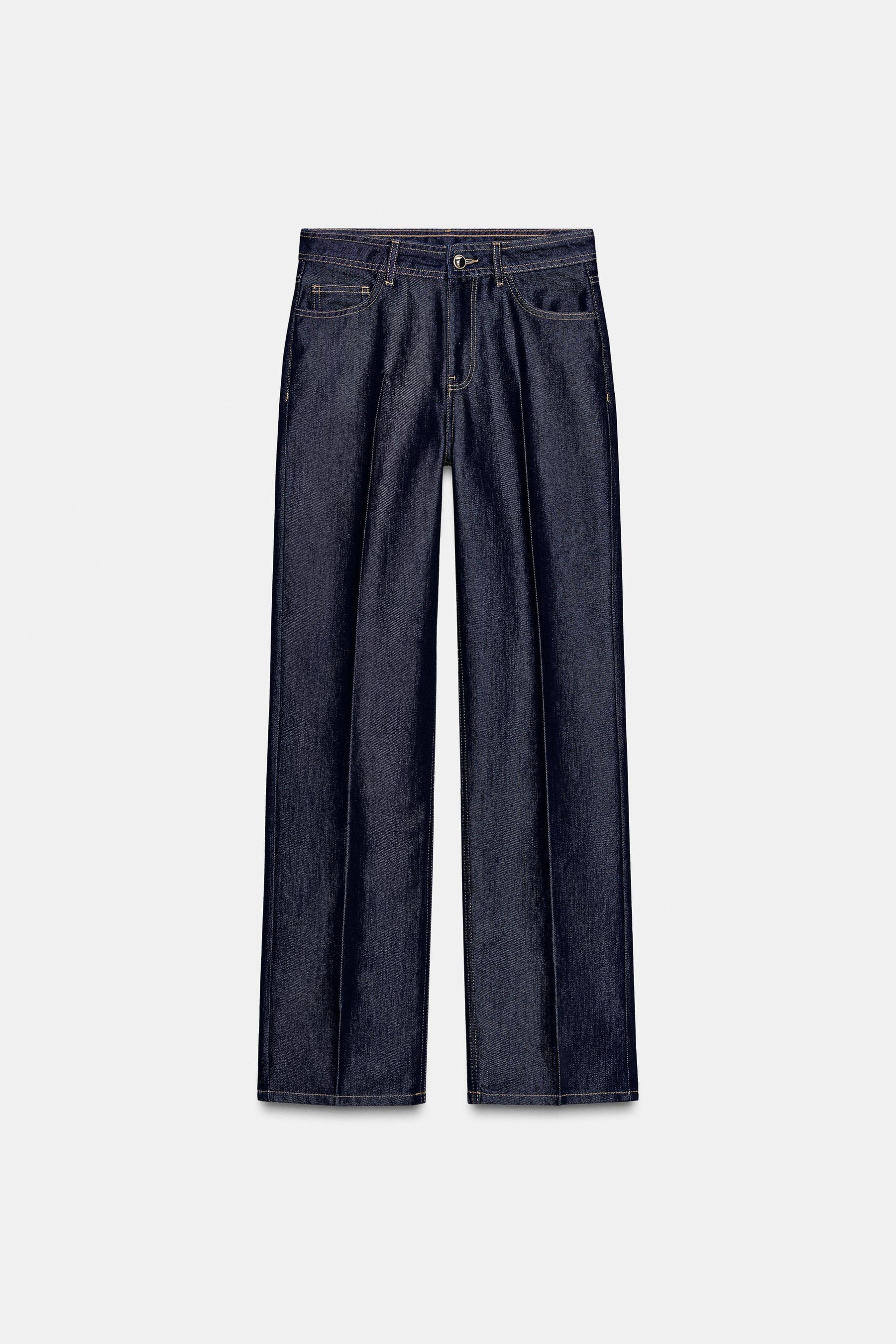 Straight mid-waist creased jeans.
