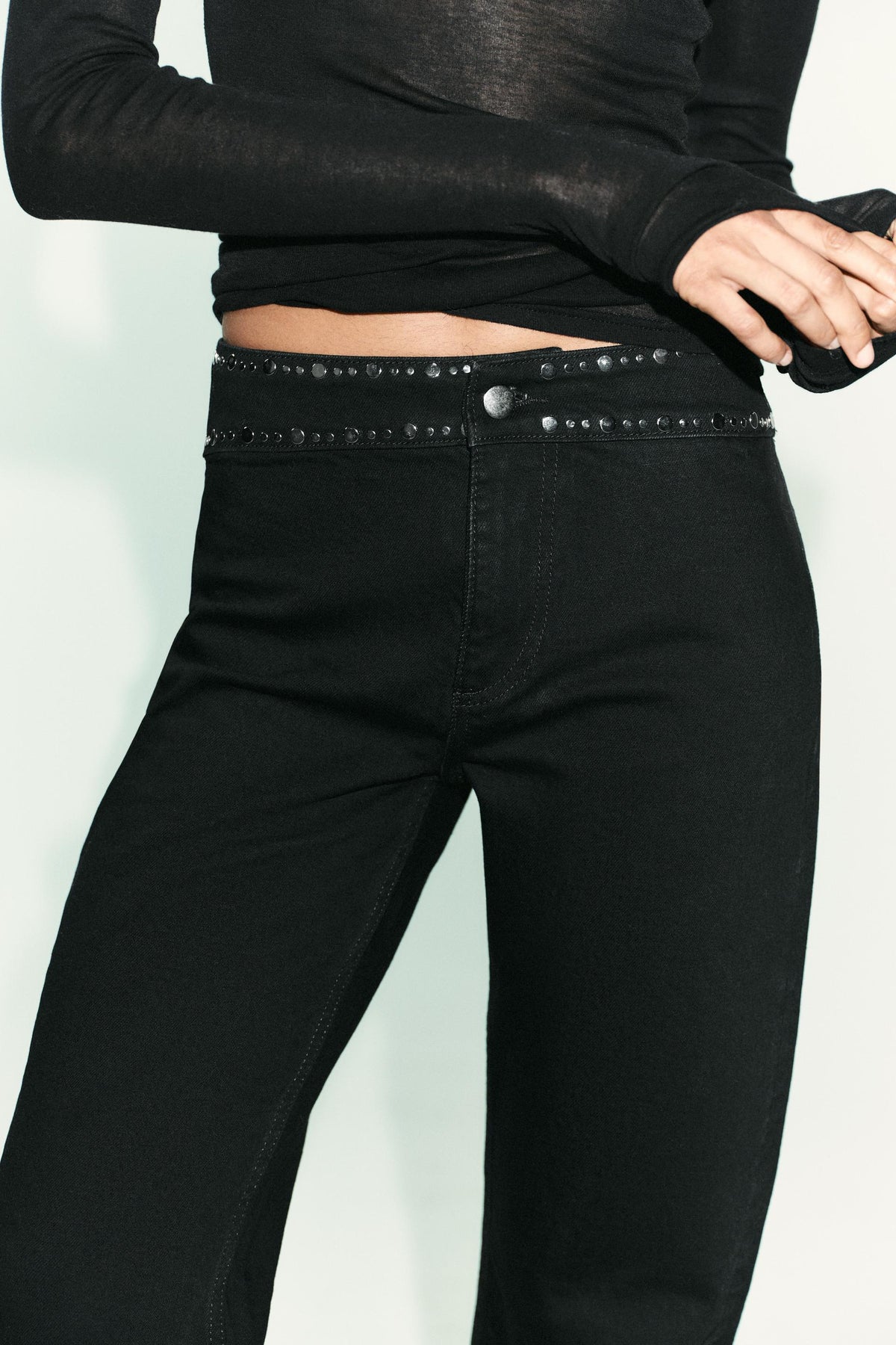 High-waist studded jeans