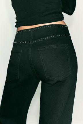 High-waist studded jeans
