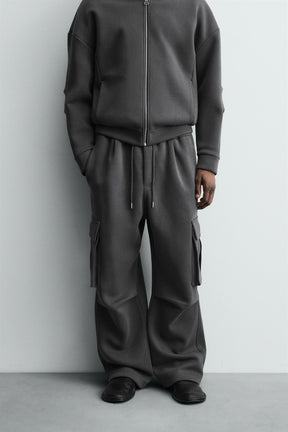 NEOPRENE-EFFECT PLEATED CARGO TROUSERS - Image 2