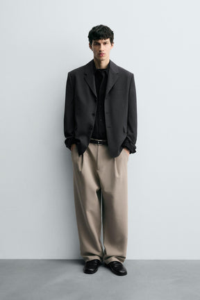 RELAXED FIT PLEATED TROUSERS - Image 1