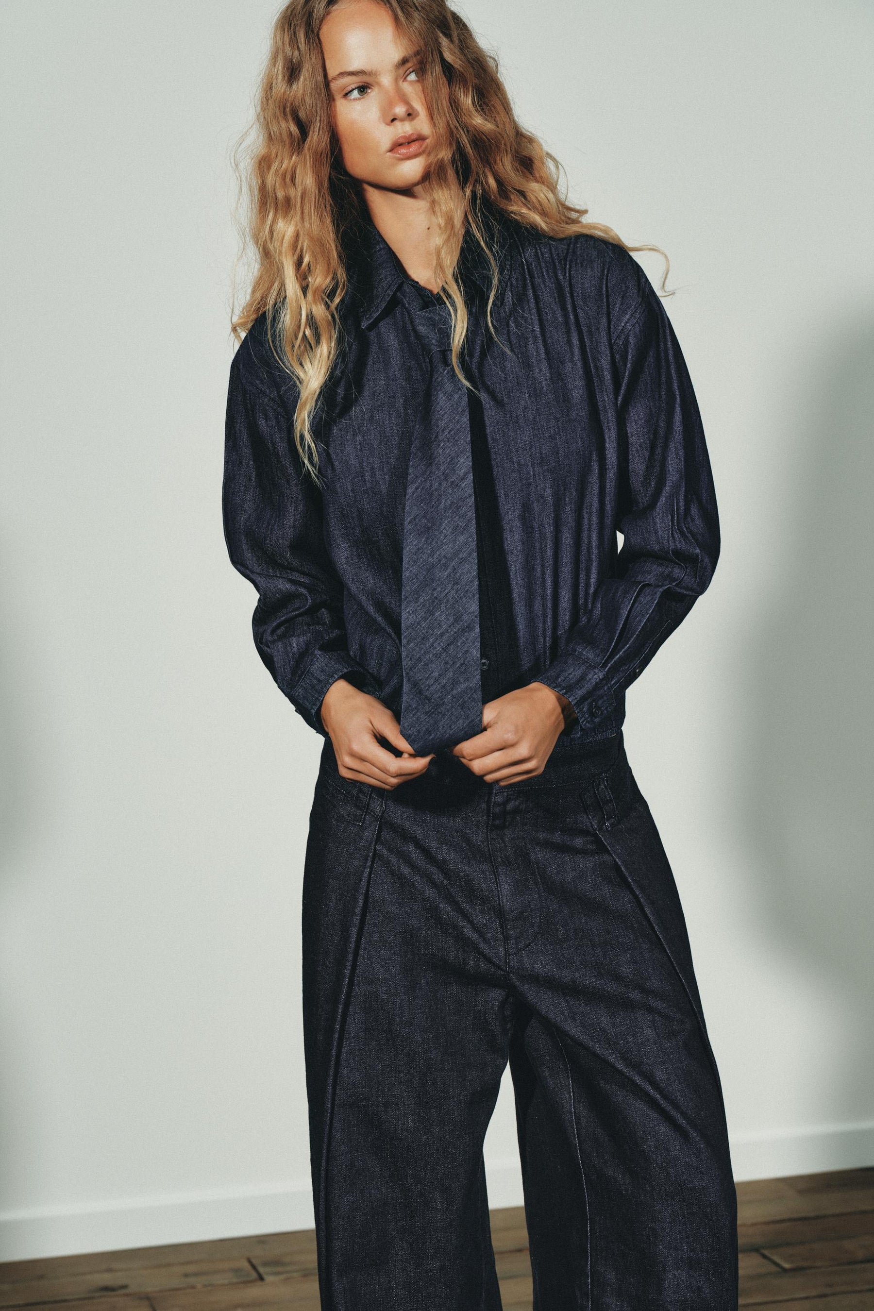 PLEATED DENIM TROUSERS