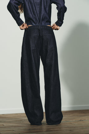 PLEATED DENIM TROUSERS