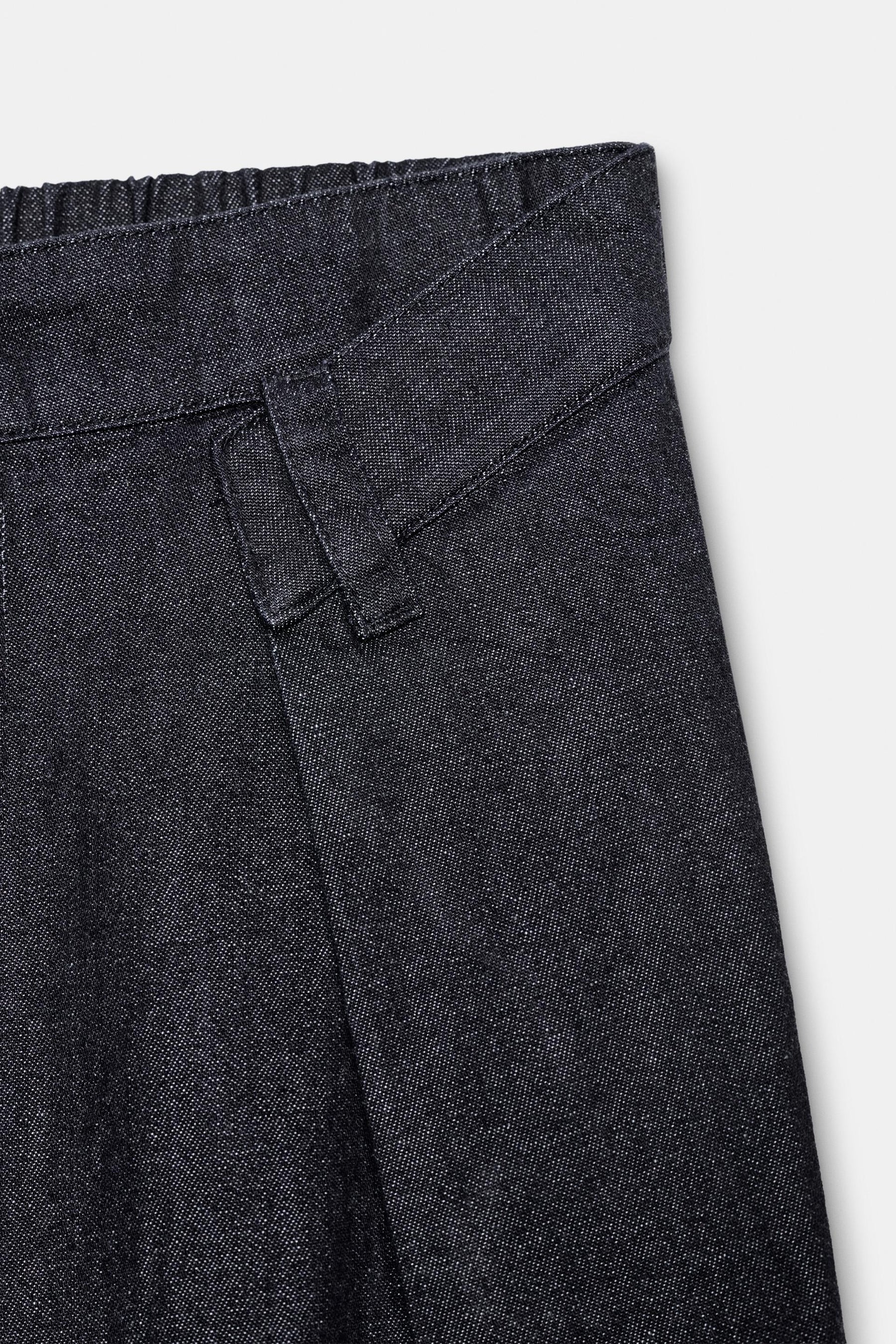 PLEATED DENIM TROUSERS