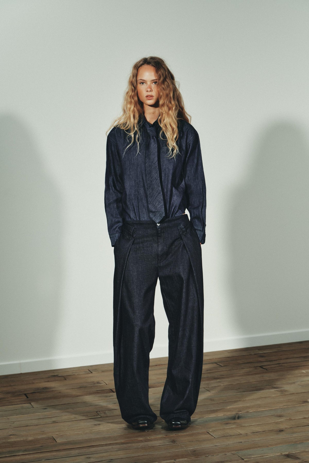 PLEATED DENIM TROUSERS