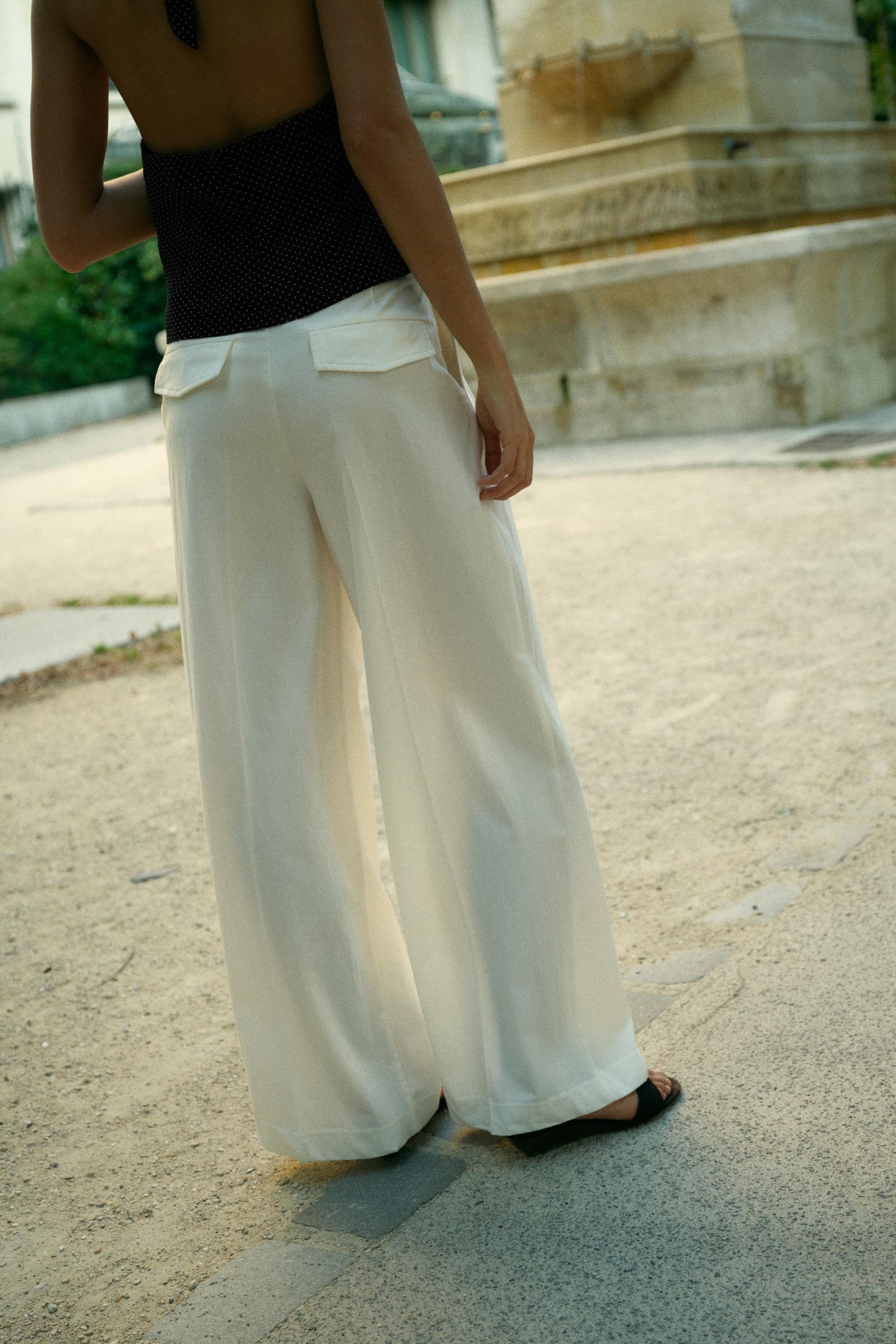 PLEATED TROUSERS WITH FLAPS