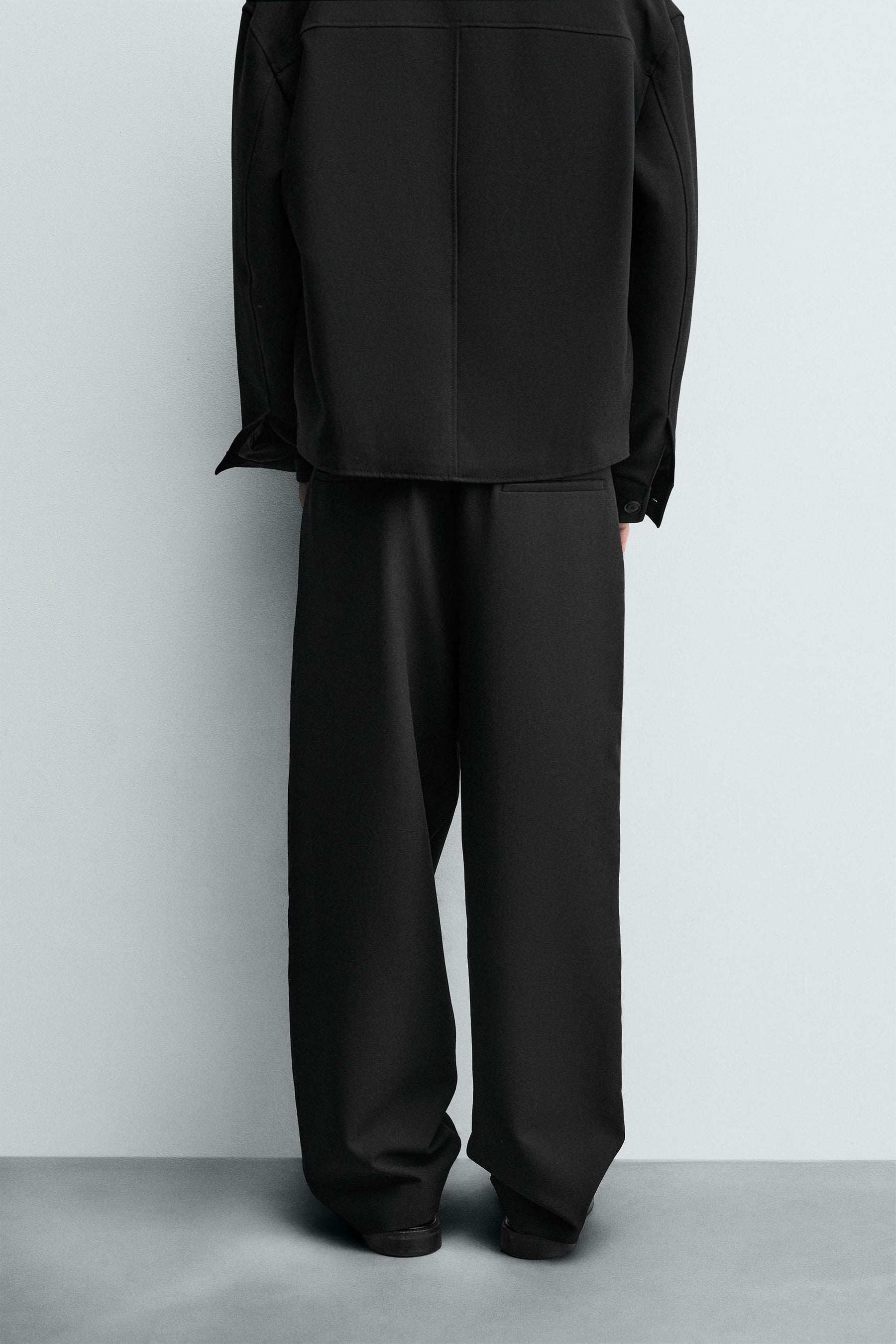 PLEATED RELAXED TROUSERS