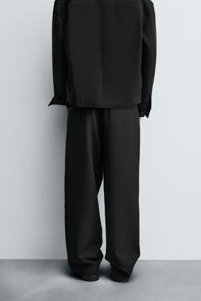 PLEATED RELAXED TROUSERS
