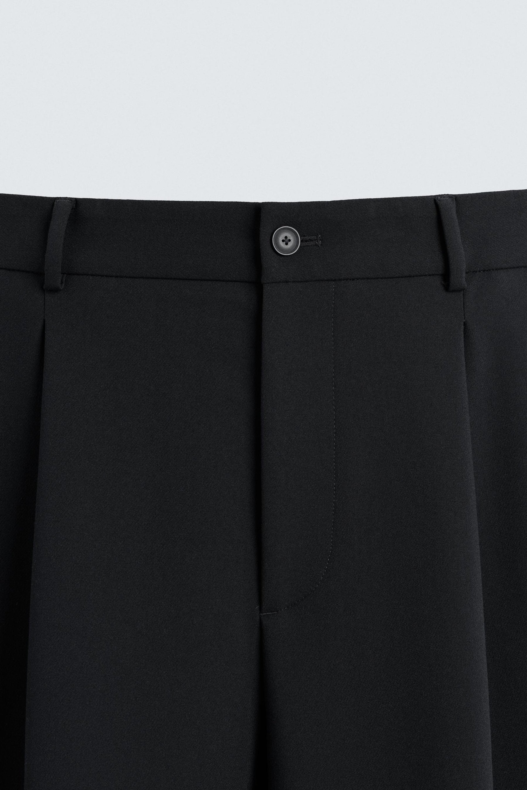 PLEATED RELAXED TROUSERS