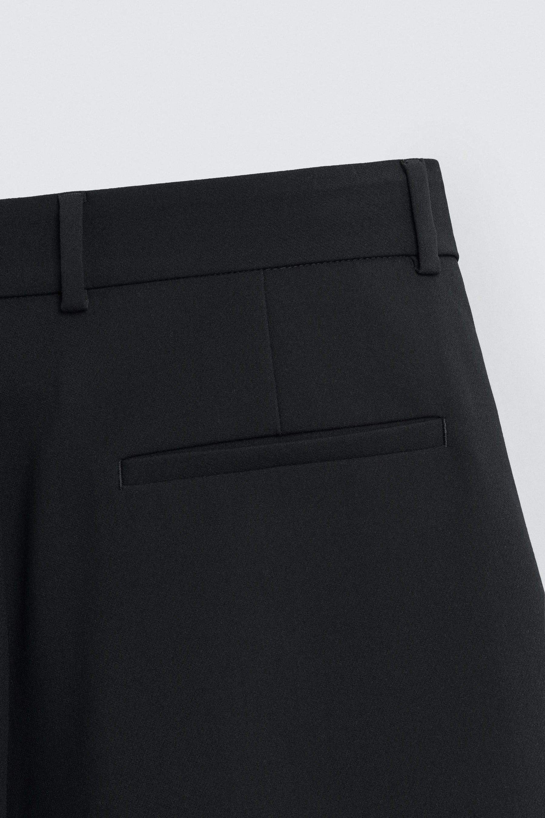 PLEATED RELAXED TROUSERS