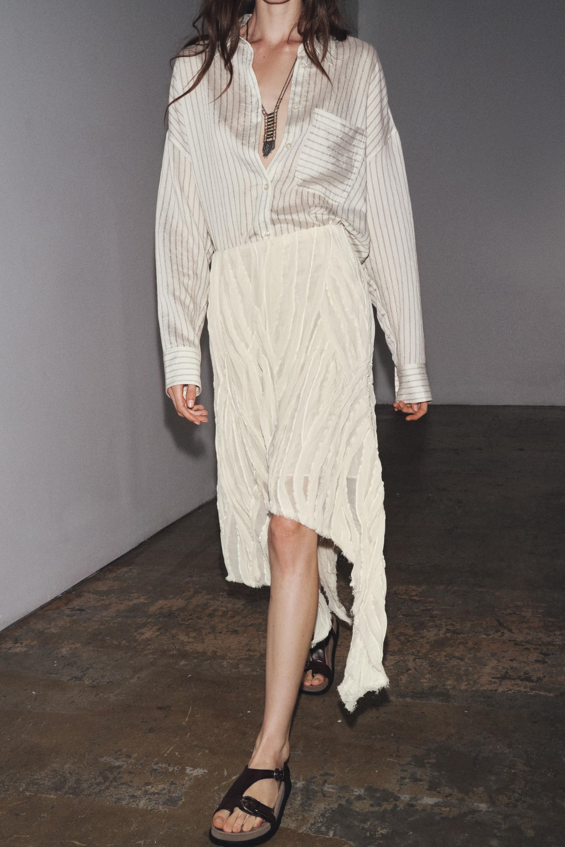 ASYMMETRIC PLEATED SKIRT