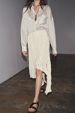 ASYMMETRIC PLEATED SKIRT