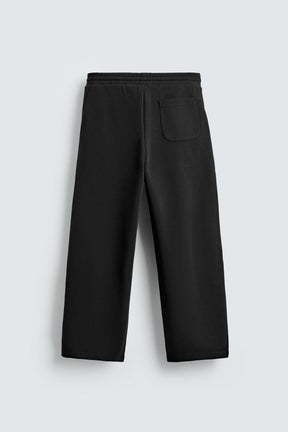 NEOPRENE-EFFECT PLEATED BALLOON FIT TROUSERS - Image 7