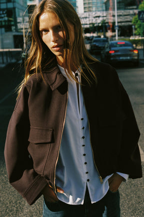 Shirt with shoulder pads