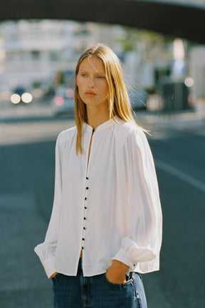 Shirt with shoulder pads